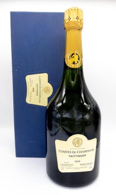 an image of a bottle of champagne next to a blue box