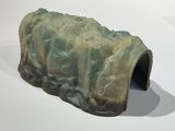 a sculpture of a rock with a hole in it