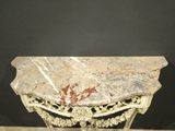 an image of a marble topped console table on a wooden floor