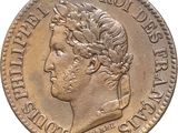 a close up of a coin with a head of a man on it