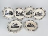 six black and white plates with a picture of a boat on them