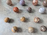 a lot of marbles that are on the floor