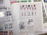 a lot of stamps on a table with a bunch of them