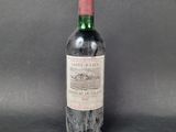 a bottle of wine that is sitting on a table