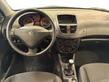 the interior of a car with a steering wheel and dashboard controls