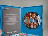 someone is holding a wii game in a blue case