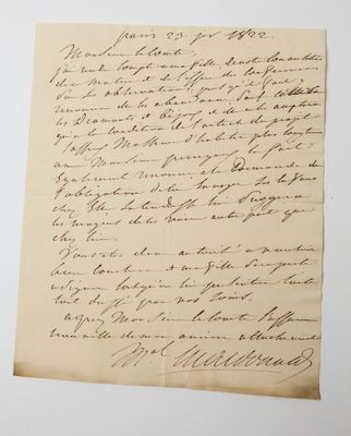 a letter written in black ink on a piece of paper