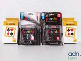 three packs of uno playing cards sitting on top of each other