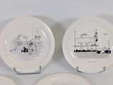 three plates with drawings of a man and a woman on them