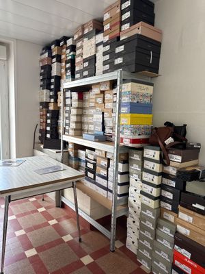 a room with many boxes and a table in it