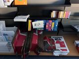 a lot of books on the shelf in the room
