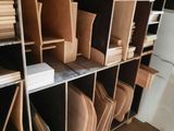 a room with a lot of boxes and boxes on the shelves