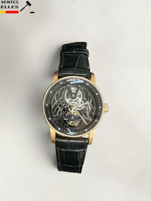 gros plan d'une montre sur une surface blanche avec un bracelet noir