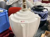 a large white vase sitting on top of a table