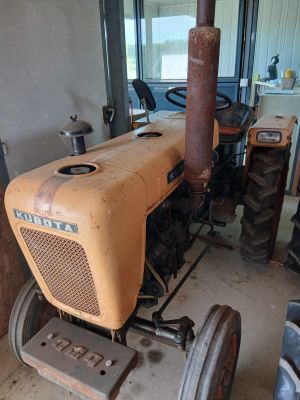 a tractor that is parked in a garage