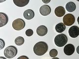 a lot of coins that are on the table