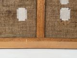 an image of a close up of a piece of fabric on a wooden frame