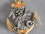 une broche en argent et en or ornée d'un dragon
