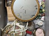 a box filled with assorted items and a mirror