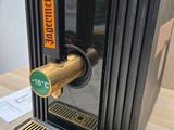 a beer dispenser that is on a table