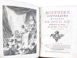 an old book with a picture of a woman holding a baby
