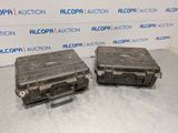two pieces of luggage sitting on top of a table next to each other