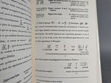 an open book with writing on it sitting on a table