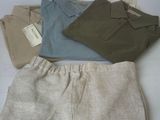 four pairs of men ' s clothing laid out on a white surface