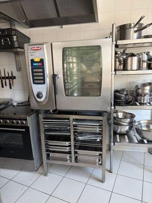 a kitchen with a lot of pots and pans on the counter