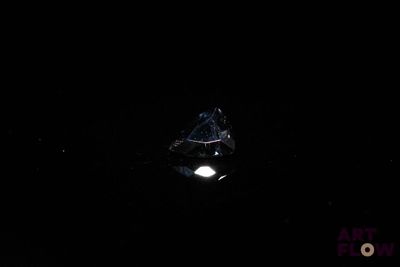 an image of a diamond in the dark of the night