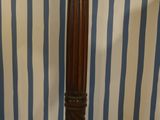 a tall wooden pole with a clock on top of it