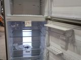 an open refrigerator that is sitting in a room