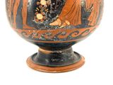 a black and orange vase with a painting on it