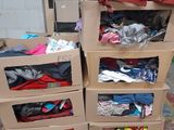 several boxes of clothes are stacked on top of each other