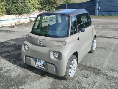 a small car that is parked in a parking lot