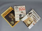 three books are sitting on a table next to each other