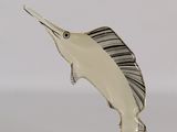 silver plated marlin fish figurine on a white background