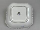 a white plate with a picture of a castle on it
