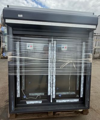 two windows that are wrapped in plastic on a pallet