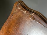 a close up of a piece of wood with peeling paint on it