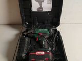 a small tool box with a cordless drill and a battery in it