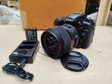 a camera that is sitting on a table next to a charger