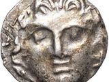a silver coin with a face of a man on it