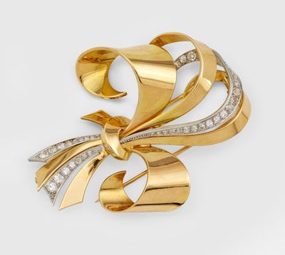 une image d'une broche en or et diamants