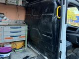 a van that has been vandalized and is in the process of painting