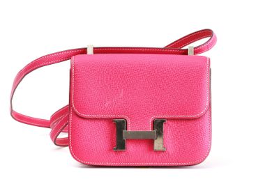 pink leather cross body bag with two metal handles