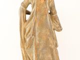 statue of a woman wearing a crown and holding a cane