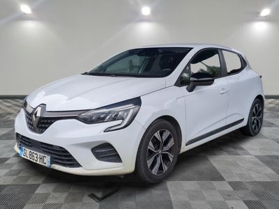 a white car parked in a garage with a checkered floor