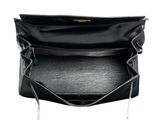 the large black leather bag is open and ready to be used
