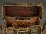 an old wooden box with a metal latch on it